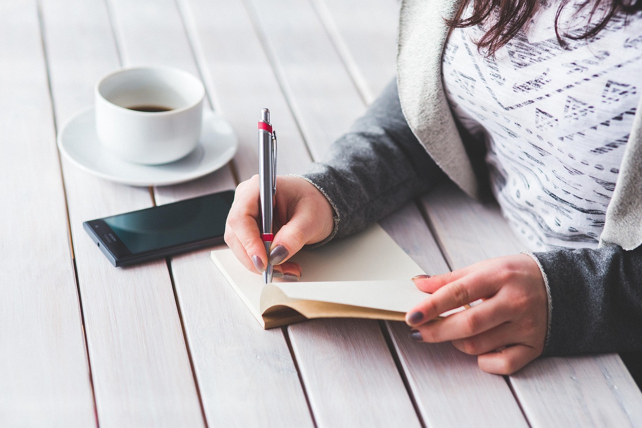 Woman, write, notepad — Transform Your Loft with a Sturdy and Stylish Loft Ladder